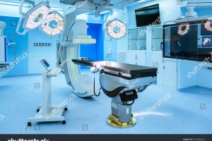 stock-photo-equipment-and-medical-devices-in-hybrid-operating-room-blue-filter-surgical-procedures-the-672030043